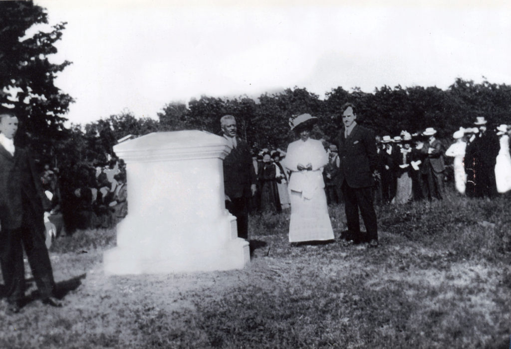 Dedication ceremony 1913. The group standing by the memorial includes Horatio P. Howard, Elizabeth Carter Brooks, and Rev Tom Sykes.